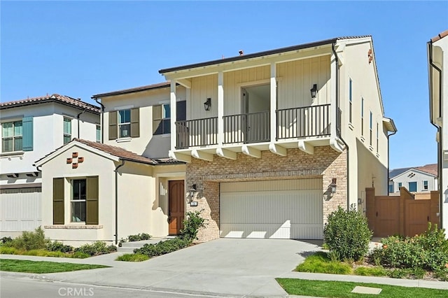 view of front of house featuring a garage and a balcony