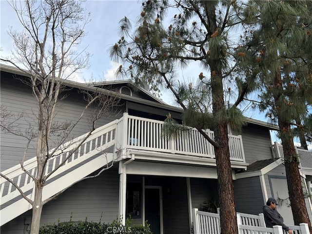 view of side of home with a balcony