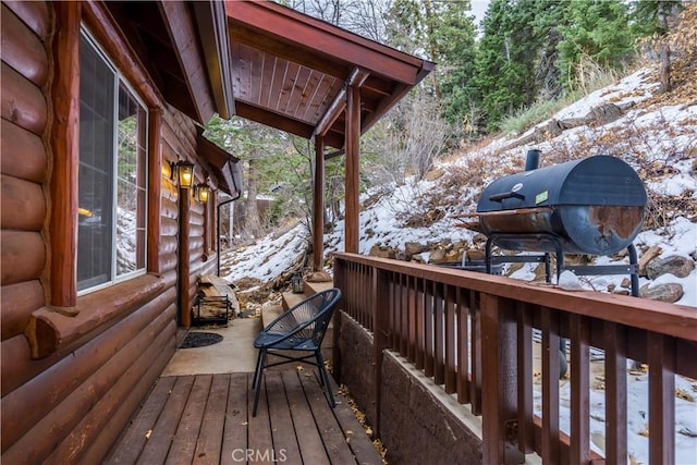 view of snow covered deck