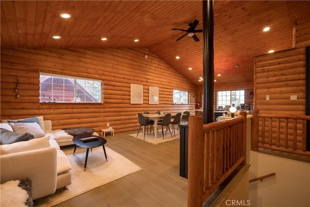 living room featuring wood ceiling, lofted ceiling, log walls, and light wood-type flooring