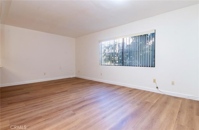 spare room with light wood-type flooring