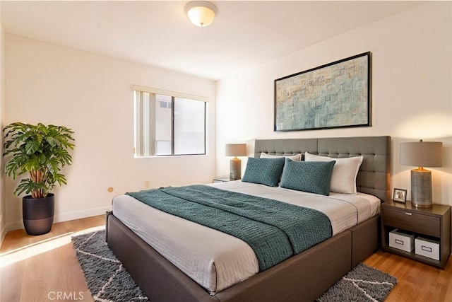 bedroom with light hardwood / wood-style floors