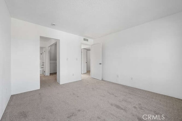 unfurnished bedroom with light carpet