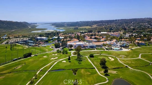 aerial view with a water view and golf course view