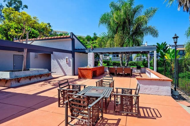 view of patio / terrace featuring fence