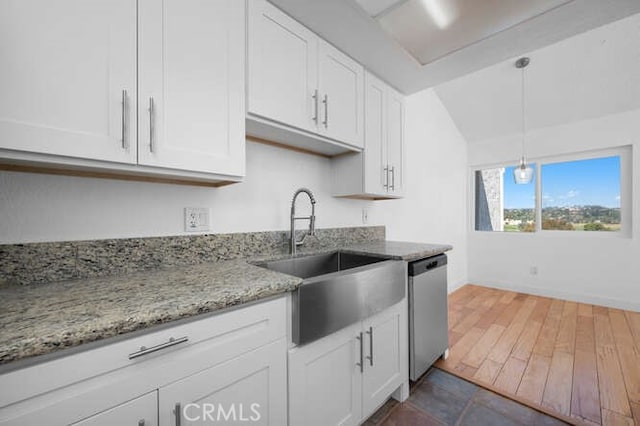 kitchen with pendant lighting, sink, stainless steel dishwasher, and white cabinets