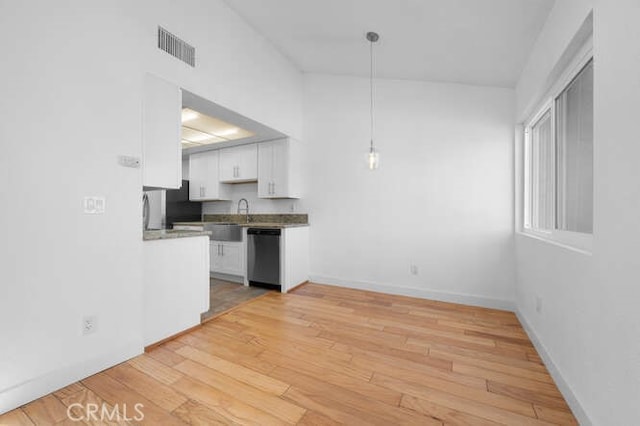 kitchen with decorative light fixtures, dishwasher, light hardwood / wood-style floors, and white cabinets