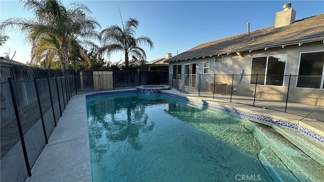 view of swimming pool with an in ground hot tub and a patio