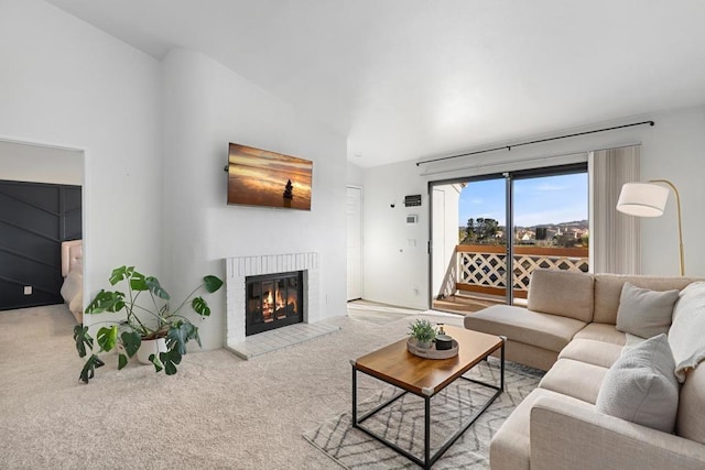 living room featuring light colored carpet and a fireplace