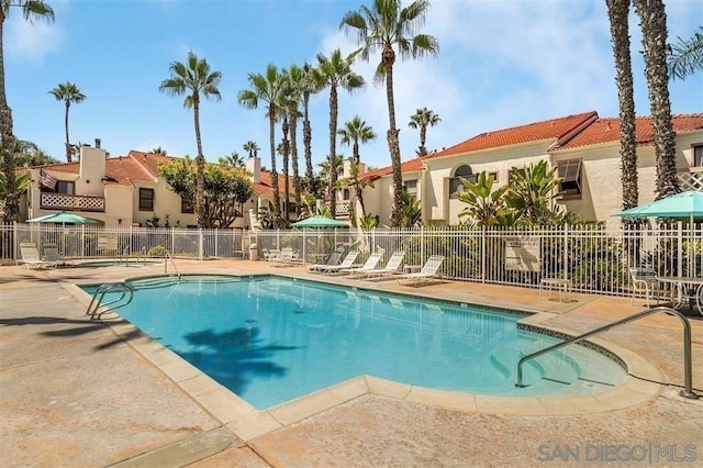 view of swimming pool with a patio area