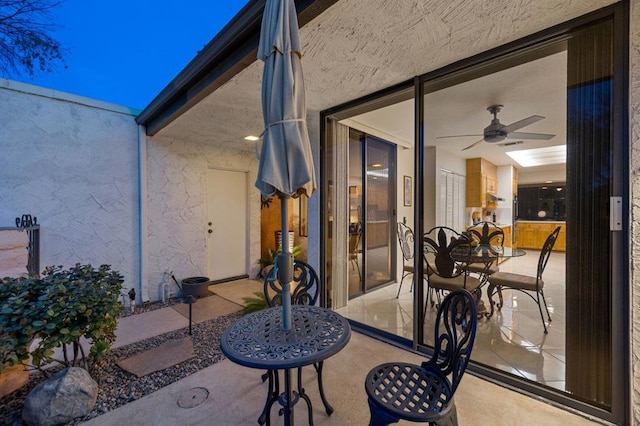 view of patio with ceiling fan