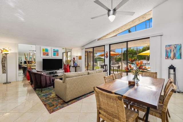 living room featuring ceiling fan, high vaulted ceiling, light tile patterned flooring, and a textured ceiling