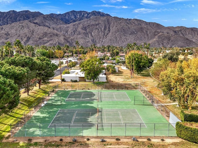 view of sport court with a mountain view