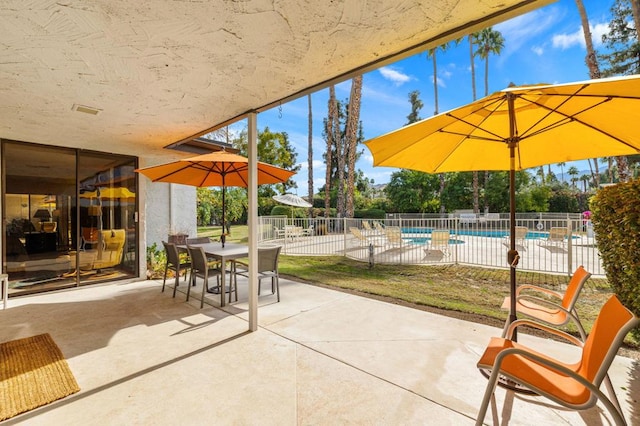 view of patio featuring a community pool