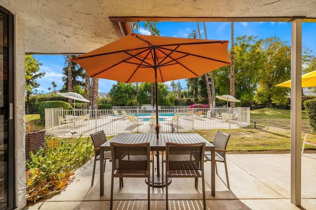 view of patio featuring a community pool