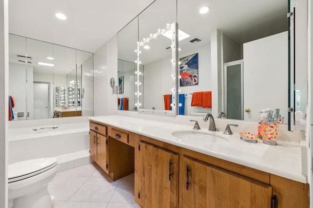 full bathroom featuring vanity, tile patterned floors, toilet, and separate shower and tub