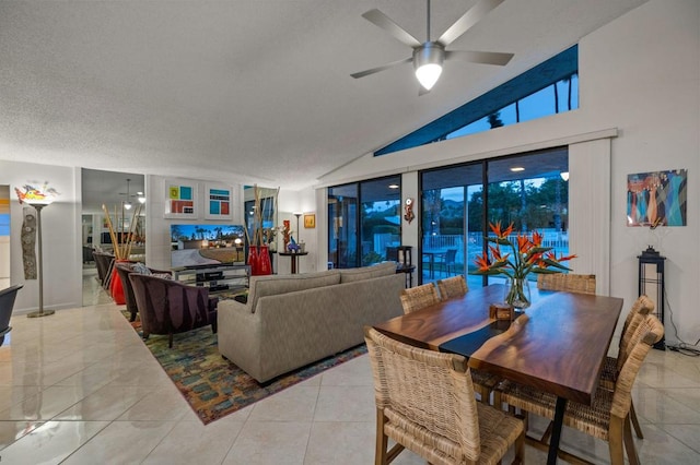 living room with light tile patterned flooring, lofted ceiling, a textured ceiling, and ceiling fan