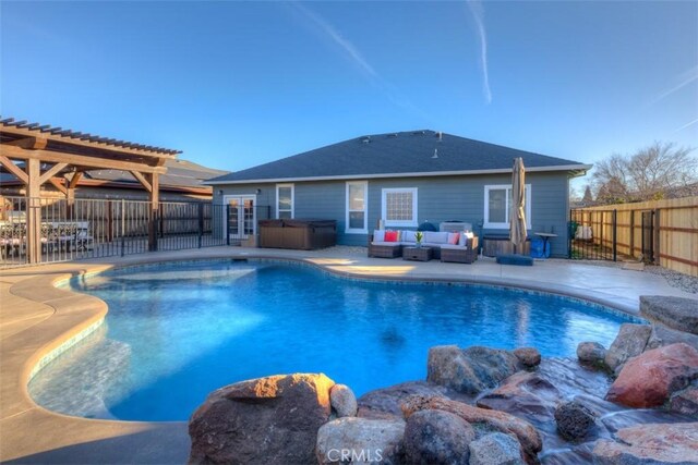 view of swimming pool with an outdoor living space, a hot tub, a pergola, and a patio area