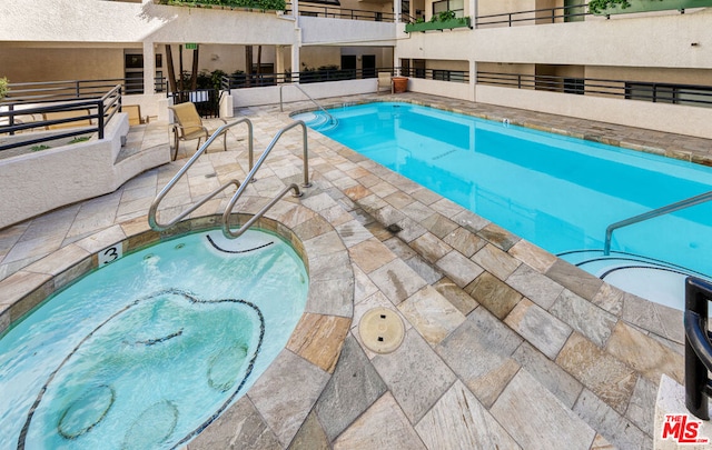 view of pool with a patio area