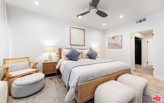 bedroom featuring wood-type flooring and ceiling fan