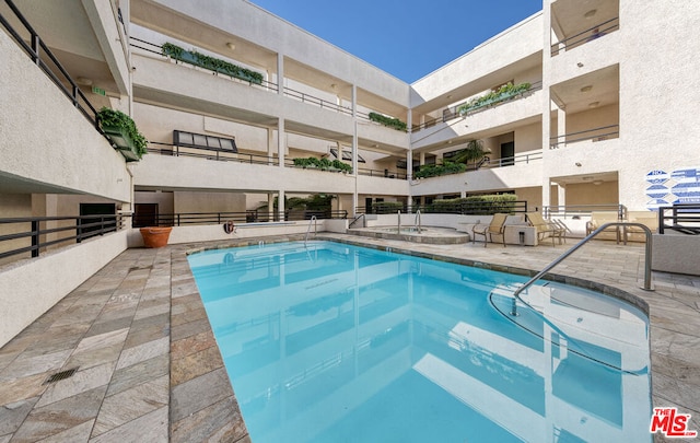 view of swimming pool featuring a patio