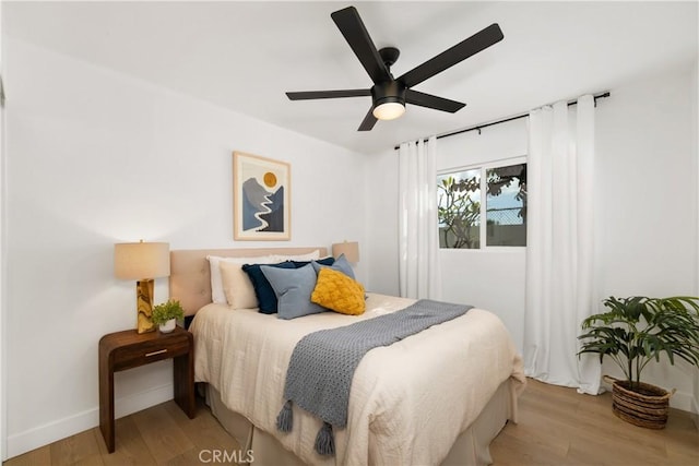 bedroom with ceiling fan and light wood-type flooring