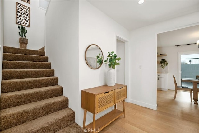 stairway featuring hardwood / wood-style floors