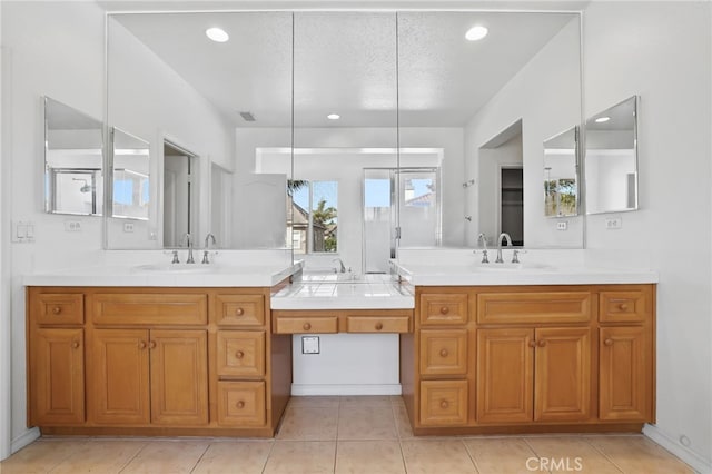 bathroom featuring recessed lighting, vanity, and tile patterned flooring