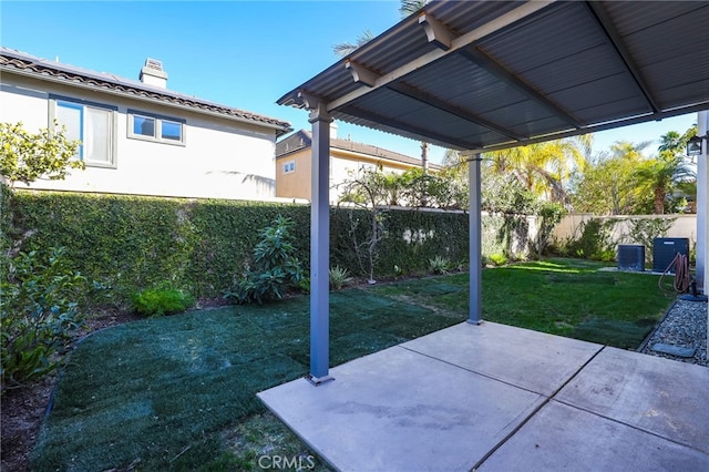 view of patio / terrace featuring a fenced backyard and central AC