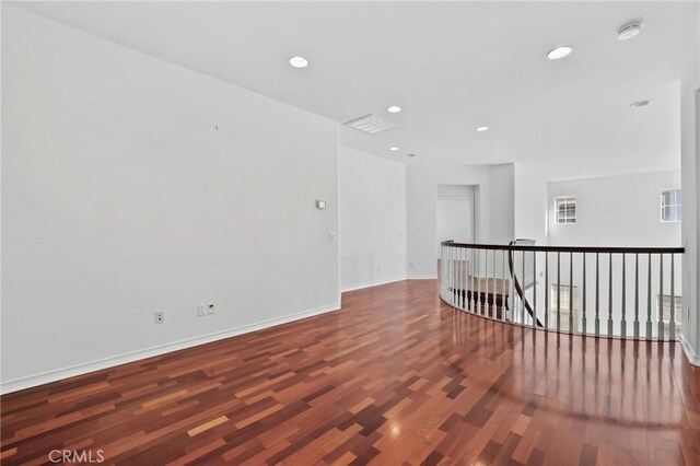 unfurnished room featuring dark hardwood / wood-style flooring