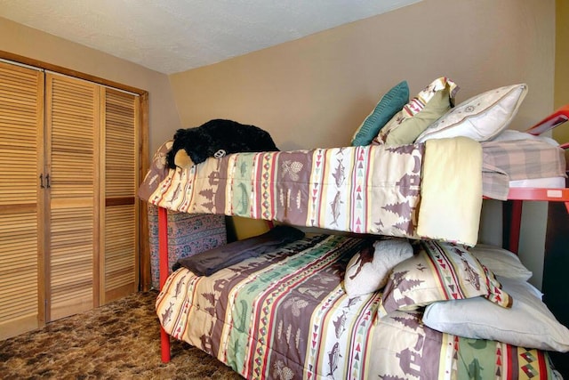 bedroom featuring carpet floors and a closet