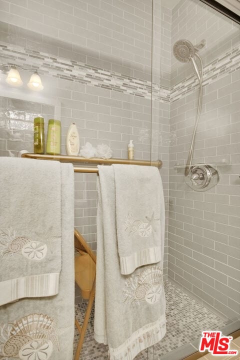 bathroom with a tile shower