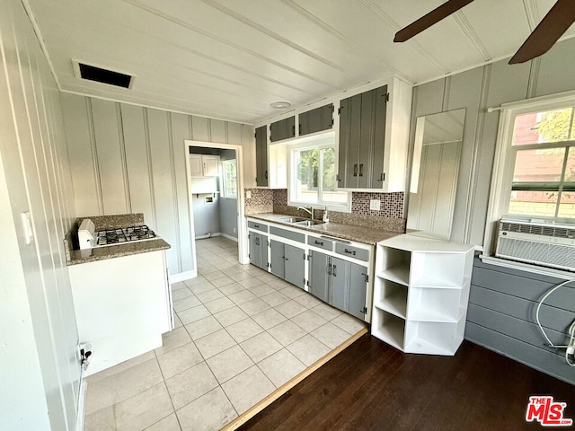 kitchen featuring gray cabinets, tasteful backsplash, sink, cooling unit, and light tile patterned floors