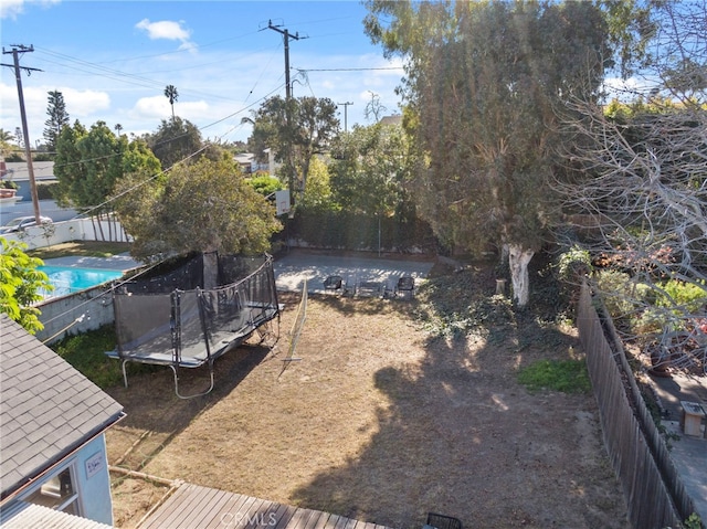 view of yard featuring a trampoline