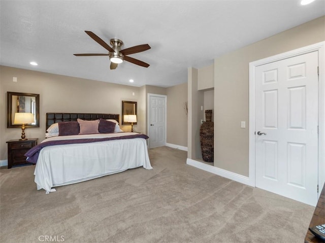 bedroom with light carpet and ceiling fan