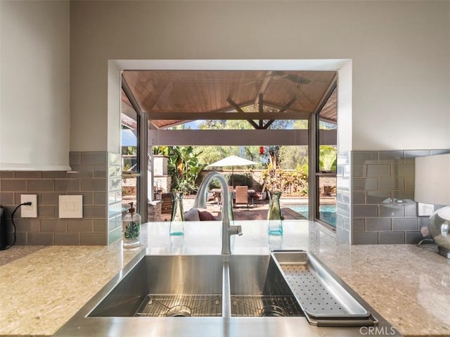 kitchen with sink and decorative backsplash