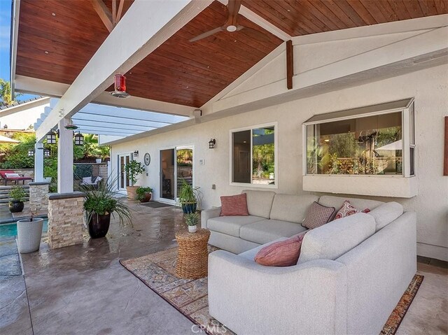 view of patio / terrace featuring ceiling fan and an outdoor living space