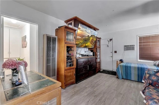 kitchen featuring a wall unit AC and light hardwood / wood-style floors