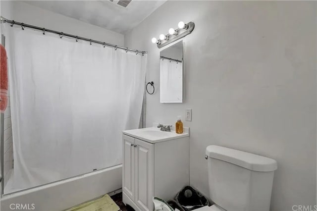 full bathroom with shower / bath combination with curtain, vanity, and toilet