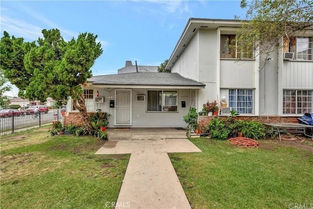 view of front of home with a front lawn and covered porch