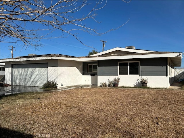exterior space featuring a yard and a garage