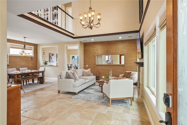 living room featuring a chandelier and a high ceiling