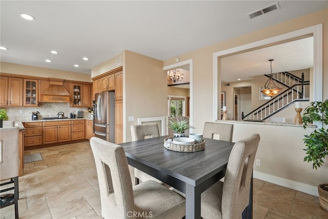 dining area featuring an inviting chandelier