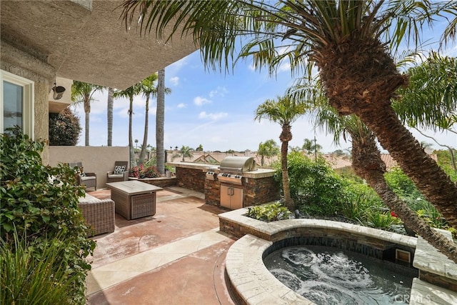 view of patio with an outdoor kitchen and grilling area