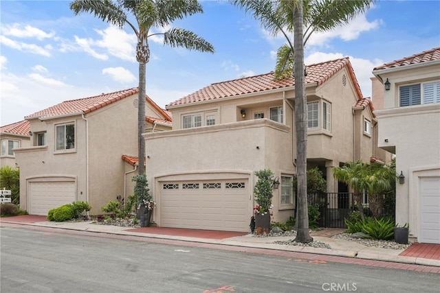 mediterranean / spanish-style house featuring a garage