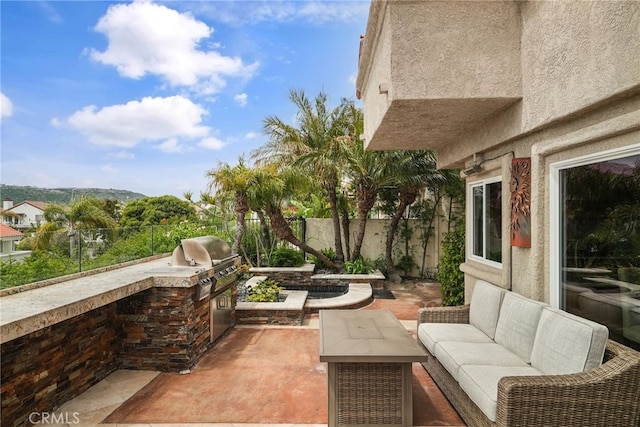 view of patio with a grill and exterior kitchen