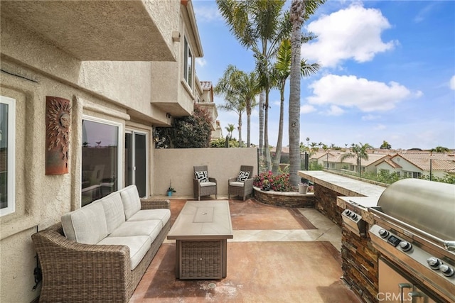 view of patio featuring grilling area, outdoor lounge area, and an outdoor kitchen