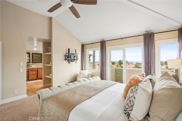 bedroom featuring lofted ceiling, ensuite bath, light carpet, access to outside, and ceiling fan