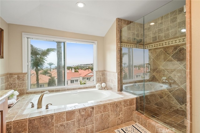 bathroom with lofted ceiling and an enclosed shower