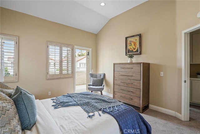 carpeted bedroom with lofted ceiling and multiple windows